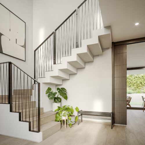 Hall de entrada con escaleras al segundo piso