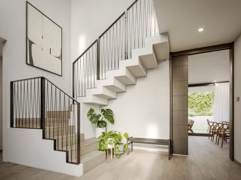 Hall de entrada con escaleras al segundo piso